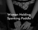 Woman Holding Spanking Paddle